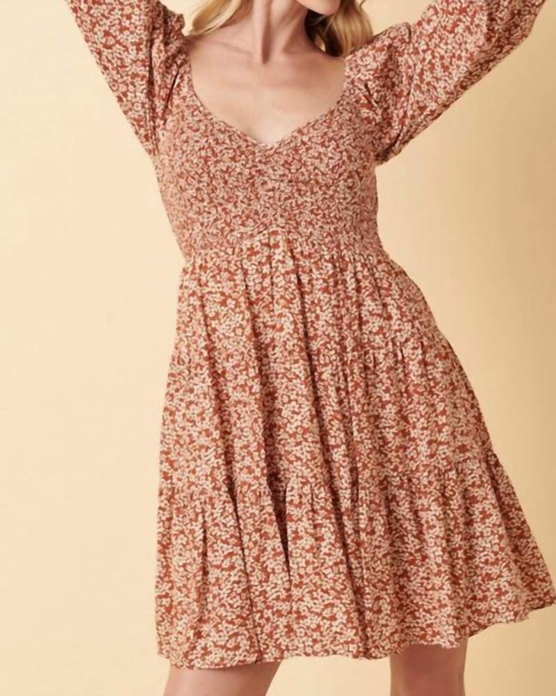 Front of a model wearing a size XL Darlin' Ditsy Floral Mini Dress in Rust in Rust by mittoshop. | dia_product_style_image_id:339470